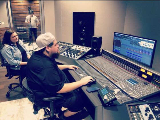 Jonathan Rosales (Big Ro Muzic) working at a studio mixing console
