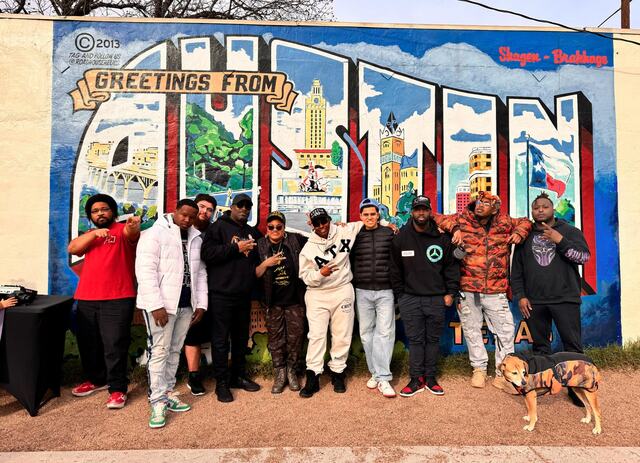 CHH Austin group in front of the Greetings from Austin mural